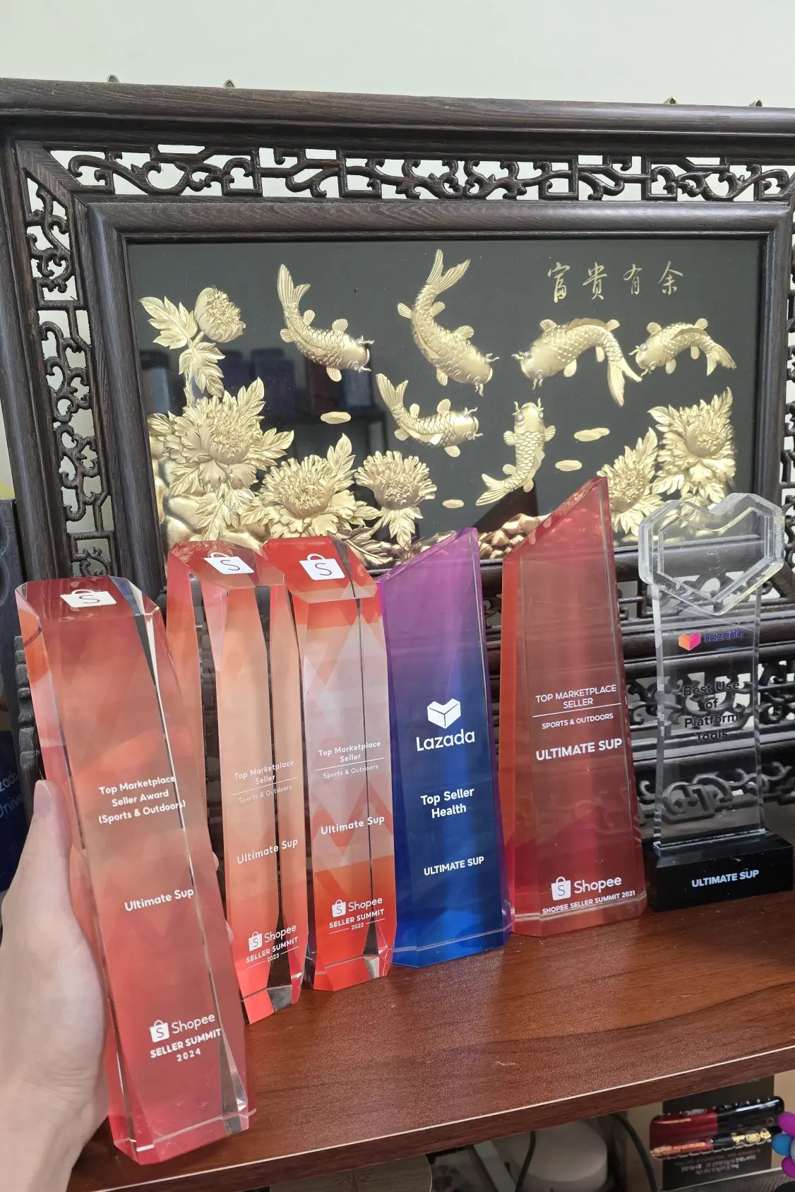 Shopee Best Store & Lazada Top Seller trophies
